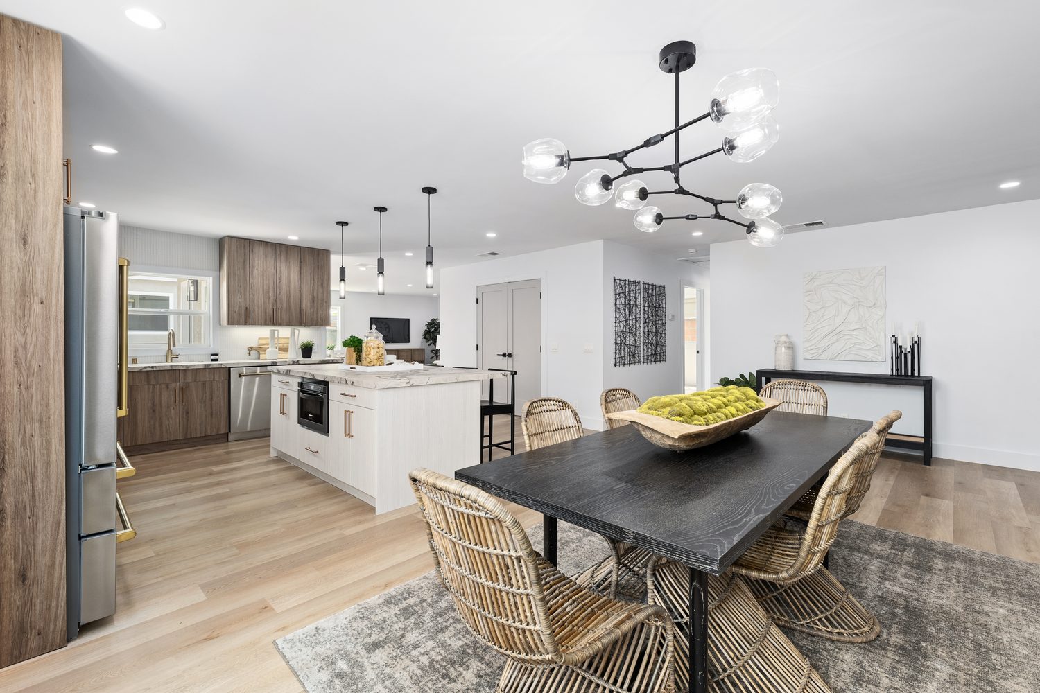 Open-plan kitchen and dining remodel in Long Beach by Girl Flip Construction, featured on HGTV
