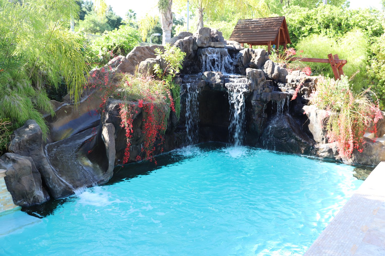 Rock grotto waterfall over the pool